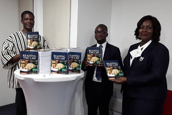 Mr Benjamin Tachie Antiedu (middle), the author, with the President of the Greater Accra Regional Branch of the Ghana Bar Association,  Mrs Efua Ghartey, and  Pastor O.S. Kwarteng, Resident Pastor of the PIWC, displaying copies of the book