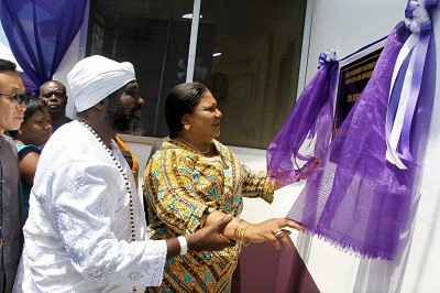 Mrs Rebecca Akufo-Addo being assisted by Nuumo Gbelenfo III (left), Osu Gua Wulomo, to inaugurate the maternity home. Picture: SAMUEL TEI ADANO