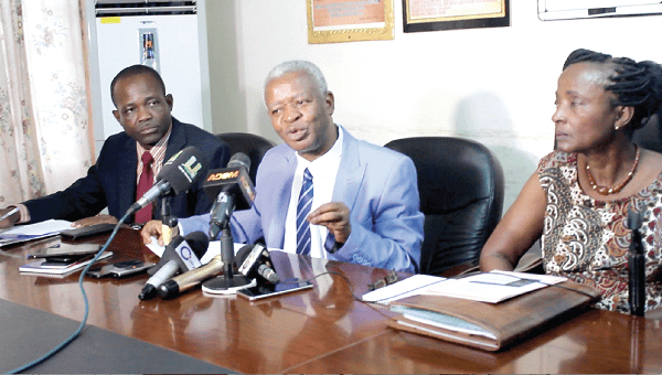 Dr Akwasi Osei (middle), the Chief Executive of the Mental Health Authority, addressing the press conference. With him are Madam Estelle Appiah (right), Board Chair of the MHA, and Mr Yaw Agyei-Wiredu, Director of Finance, MHA.  Picture: Patrick Dickson 