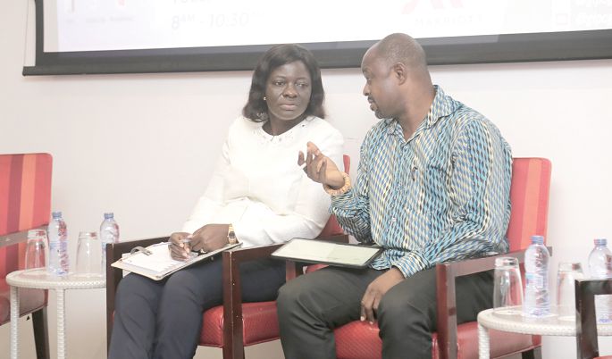  Mr Albert Kassim Diwura, the Deputy Chief Executive Officer (CEO), Ghana Export Promotion Authority (GEPA), conferring with Ms Kate Abbeo, Deputy Executive Secretary (Corporate Affairs), Ghana Free Zones Authority, during the breakfast meeting. Picture: EMMANUEL ASAMOAH ADDAI  