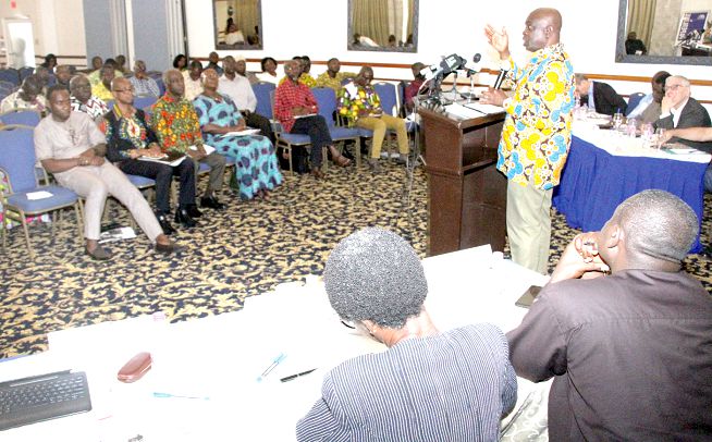 Mr Kwesi Adu Amankwa (standing), General Secretary, ITUC, speaking at the forum on the merger of trades unions in Accra. Picture: SAMUEL TEI ADANO