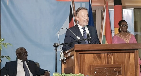 Ambassador Christoph Retzlaff delivering his Unity Day address. With him are Mrs Ursula Owusu-Ekuful (right) and Mr Yaw Osafo-Maafo (seated left), Senior Minister.