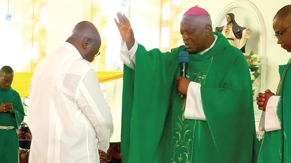  Rt Rev. Joseph Afrifa Agyekum (right), the Catholic Bishop of the Koforidua Diocese, saying a prayer for President Akufo-Addo