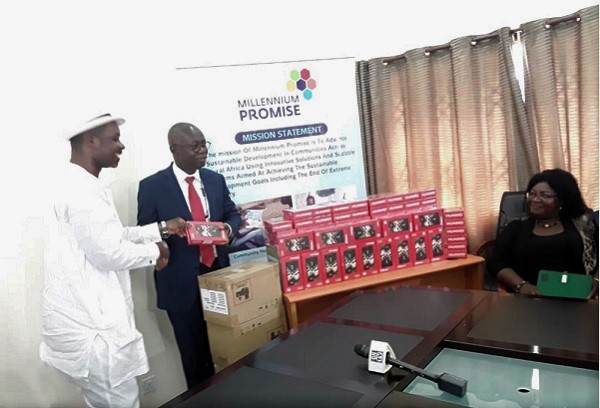 Chief Nat Ebo Nsraka (left) presenting one of the devices to Prof. Kwasi Opoku-Amankwa