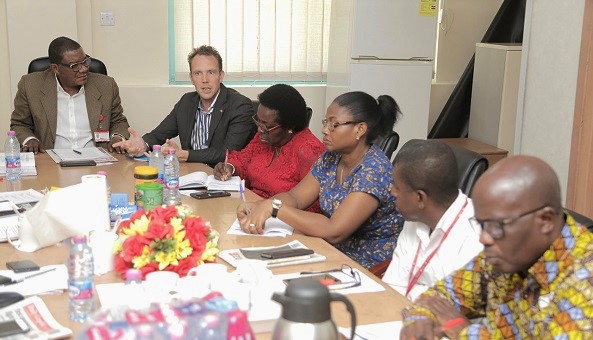 Mr Pieter Smidt Van Gelder (2nd left), Head of the Political Section and Deputy Head of Mission, European Union (EU), addressing members of the Editorial Board during his visit to GCGL. With him is Mr Kobby Asmah (left), Editor, Daily Graphic.    