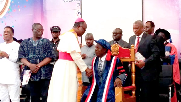  Prof. Honyenugah being taken through the dedication rites by the Catholic Bishop of the Ho Diocese, Most Rev. Emmanuel K. Fianu