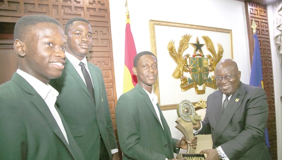 Winners of the 2019 National Maths and Science Quiz from St Augustine’s College presenting the trophy to President Nana Addo Dankwa Akufo-Addo at the Jubilee House in Accra.