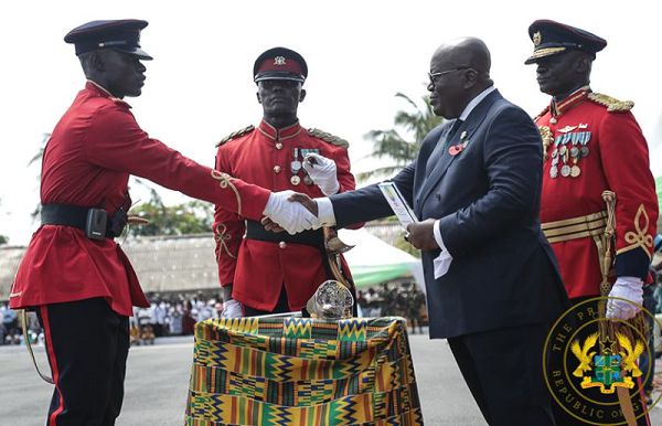 President Nana Addo Dankwa Akufo-Addo presenting the All Round Best Officer Cadet in Regular Career to Senior Under Officer Barnette Nketia at the ceremony. Picture: SAMUEL TEI ADANO