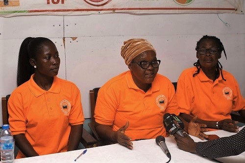 Ms Eva Attakpah (middle), National President, Domestic Services Workers Union (DSWU), speaking in the press conference, while Ms Bernice Mawuli (left), Eastern Regional Secretary, DSWU and Ms Esther Kosi (right), General Secretary, DSWU, look on. Picture: NII MARTEY M. BOTCHWAY