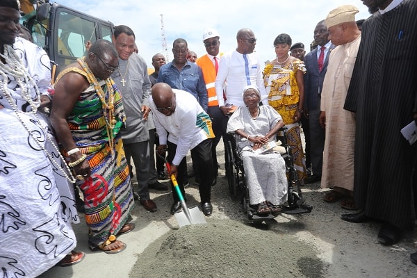 President  Akufo-Addo cutting the sod for the construction of the Obetsebi  Interchange. With him are  Nii Ayikai,III (left),  Akamaijen Mantse and Mad. Augustina Obetsebi