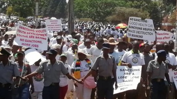 People marched towards the sports stadium in the capital, Harare