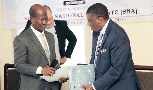 Dr Baba Musah (right) interacting with Mr Eric Koranteng after the workshop.