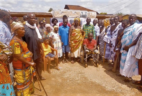 Nana Amoahemaa Gyasi (middle), some elders of the area and the beneficiaries