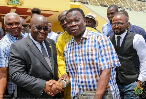  President Akufo-Addo shaking hands with D.K.Poison (right) during the visit