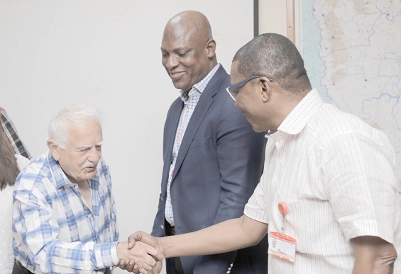 Mr Bhagwan Khubchandani (left) exchanging pleasantries with Mr Kobby Asmah during the visit. With them is Mr Ato Afful