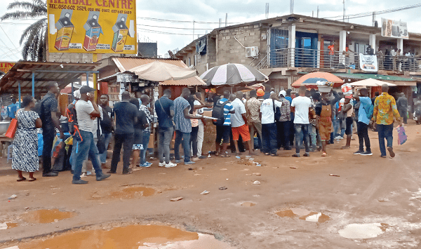 Customers of Menzgold queued at the Madina Tamale Station in Accra for the validation exercise