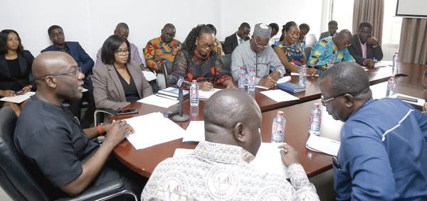 Mr Kojo Oppong Nkrumah (left) and Prof. Samuel Kobina Annim (back to camera) at the inauguration of the census committee