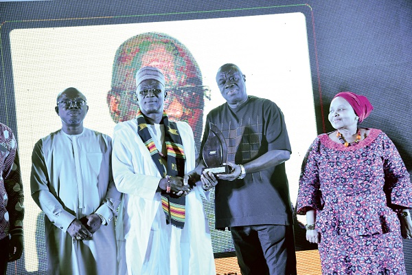  Dr Ibrahim Awal Mohammed (2nd right), the Minister of Business Development, presenting the Overall Best Industrialist of the Year award to Dr Kwabena Adjei, the Founder and Group Chairman of KASAPREKO Company Limited. With them are Mr Sam Ato Gaisie (left) the President of the Entrepreneur Foundation of Ghana, and Madam Lulu Xingwana (right), the South African High Commissioner in Ghana. Picture: EBOW HANSON 