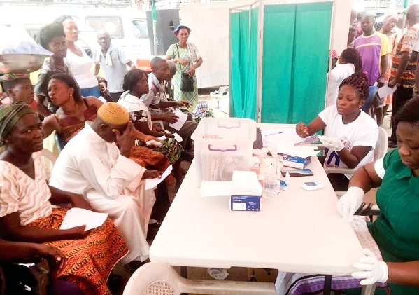 Medical personnel from the Oda Community Hospital offering free health screening to residents of Oda