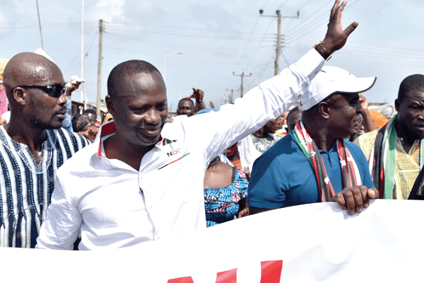 Mr Armah Kofi Buah (hand stretched), the MP for Ellembelle,  responding to cheers from constituents after being declared the winner in the primary