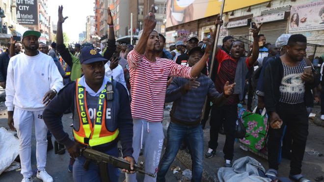  Police have struggled to contain the crowds of rioters who have looted shops and torched vehicles 