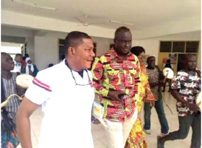  Mr Kobby Asmah (left) Editor, Daily Graphic escorting  Dr Hafiz Bin-Salih, the Upper West Regional Minister, after the minister had delivered his address
