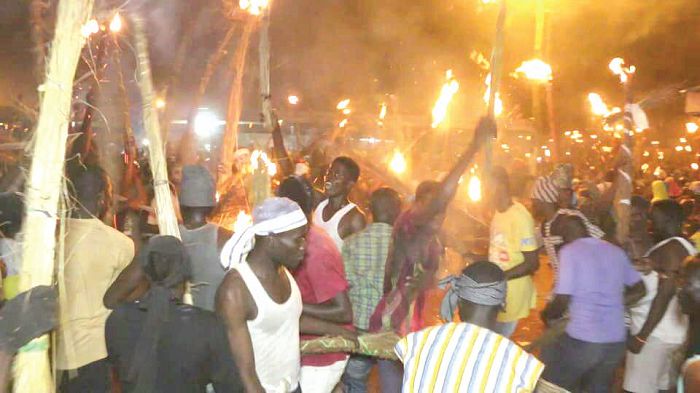  Some of the revellers displaying their straw torches