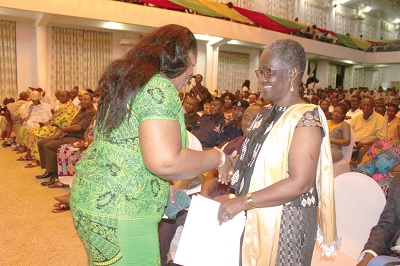 Ms Kumi-Richardson (left), the Bono Regional Minister, in a handshake with Ms Ajoa Yeboah-Afari