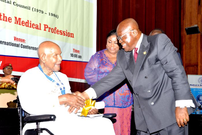  President Nana Addo Dankwa Akufo-Addo congratulating Dr Emmanuel Evans-Anfom (left), a former Chairman of the Medical and Dental Council. Picture: SAMUEL TEI ADANO