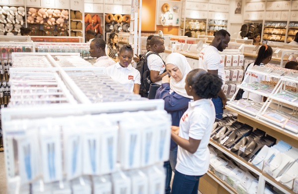  Some customers sampling some products in the store located within Marina Mall