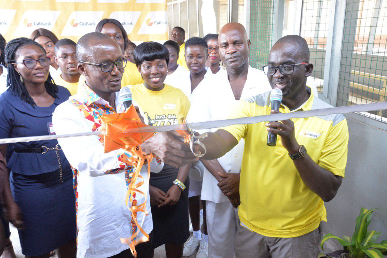 Mr Samuel K. Boafo (right), Head, Human Resource being assisted by Mr Julius Kuusaalesuo, Deputy Director, Administration, Accra Psychiatric Hospital to cut the tape to handover the refurbished male ward at the Accra Psychiatric Hospital. Pix BY SAMUEL TEI ADANO