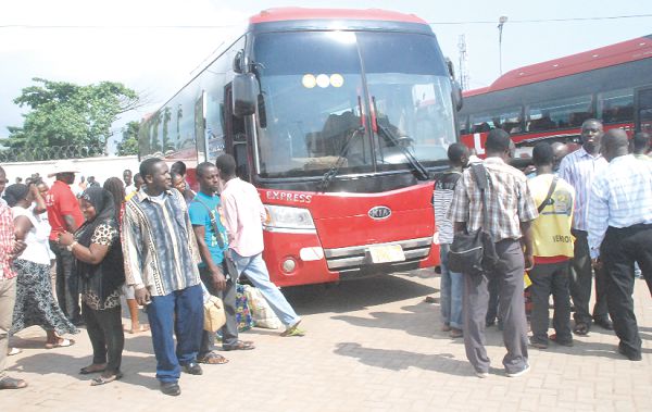  Passengers boarding a bus in Accra