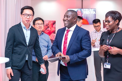 Mr Addo (middle) interacting with some participants after the event