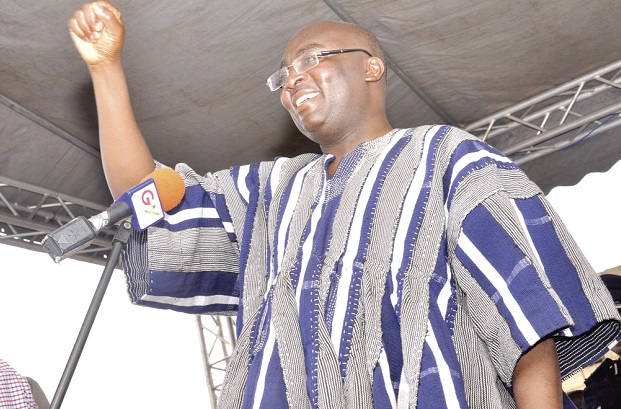 Vice-President Dr Mahamudu Bawumia (right), responding to cheers from some of the traders at the Agbogbloshie market.  Pictures: SAMUEL TEI ADANO