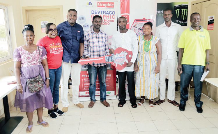 Mr Franklin Sowah (3rd left), Director, Sales and Marketing, Graphic Communications Group Limited;  Mr Alfred Agyena (4th left), General Manager, Devtraco,  Mr Maxwell Nortey (5th left), winner of the second draw, Graphic-Devtraco Home Promo, during the ceremony in Tema