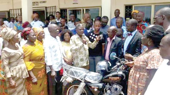  Mr Andrews Teddy Ofori (holding microphone), the Hohoe Municipal Chief Executive,   making some remarks before handing over the motorbikes