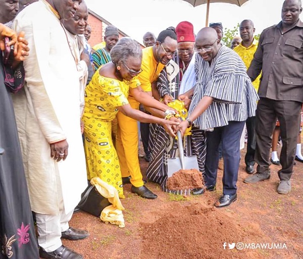  Dr Mahamudu Bawumia (2nd right) being assisted by Mr Adadevor (middle), Mrs Nabila Williams, a Board member of MTN Ghana Foundation, and other officials of MTN to cut the sod
