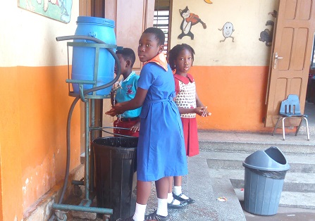 Some schoolchildren of the Tot-to-Teen International School was their hands using the Veronica bucket