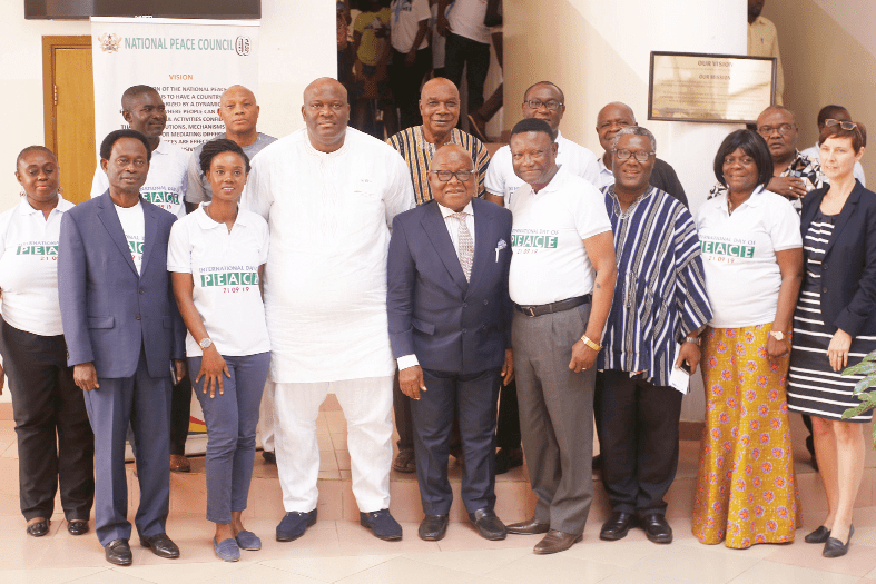 Prof. Aaron Mike Oquaye (midle), Rev. Prof. Emmanuel Asante (4th right), Chairman, National Peace Council, Mr Henry Quartey (4th left), Deputy Minister of the Interior, Ms Sylvia Lopez-Ekra (2nd left), UN Resident Coordinator, Ms Silke Hollander (right), UNDP Resident Representative, and some members of the Peace Council Governing Board after the ceremony. 