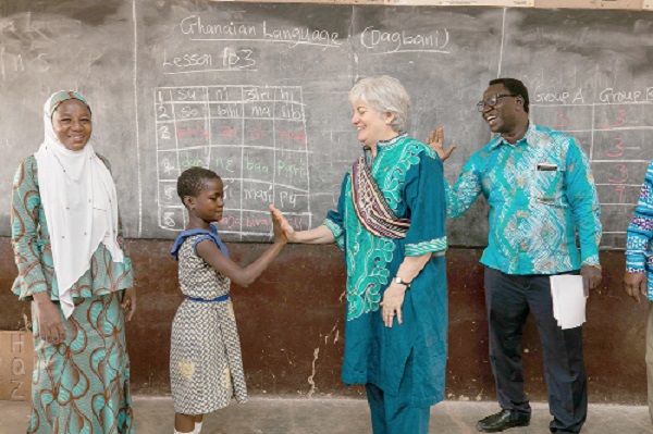 U.S. Ambassador to Ghana, Stephanie S. Sullivan, congratulating a pupil of the Kaladan SDA Primary ‘A’ school during her official trip to Tamale in March 2019