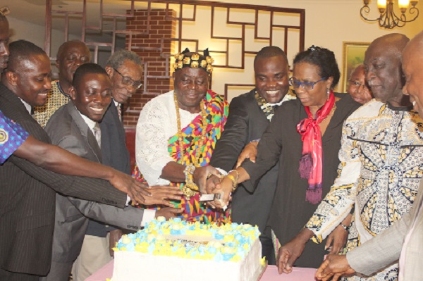 Torgbui Sri III (middle),  Mr Richmond Etse Worgba (5th right) and other executives of the club cutting the cake to launch the 30th anniversary celebration in Accra