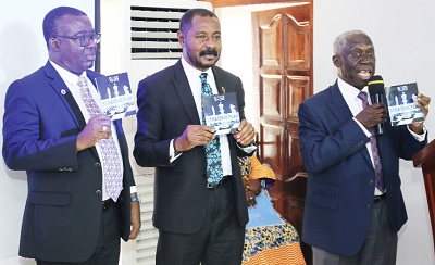 Mr Yaw Osafo-Maafo (right), the Senior Minister, launching the Ghana Anti-Corruption Strategic Plan with the support of Nana Osei Bonsu (middle) and Mr Walter Amewu, Deputy Director of EOCO