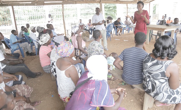 Mrs Araba Incoom (standing right), Deputy Technical Manager, Mycotoxins Ethistamin Laboratory, Ghana Standards Authority (GSA), educating the farmers on aflatoxins when the GSA organised an educational talk for farmers at Abesi in the Shai-Osudoku District in the Greater Accra Region
