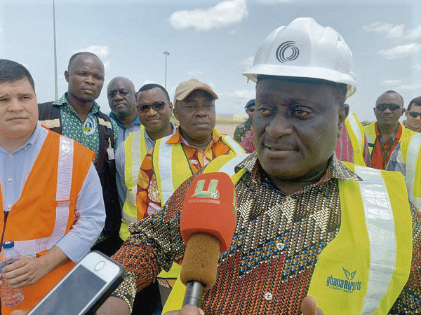 Mr Yaw Afful (right) speaking to some journalists at the project site