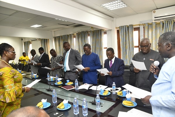 Mr Benito Owusu Bio (right), Deputy Minister of Lands and Natural Resources, taking the new board of the Ghana Geological Survey Authority (GGSA) through an oath 