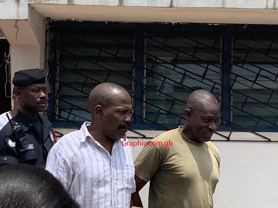 Colonel Samuel Kojo Gameli (in white ) and Gershon Akpa being escorted from the court