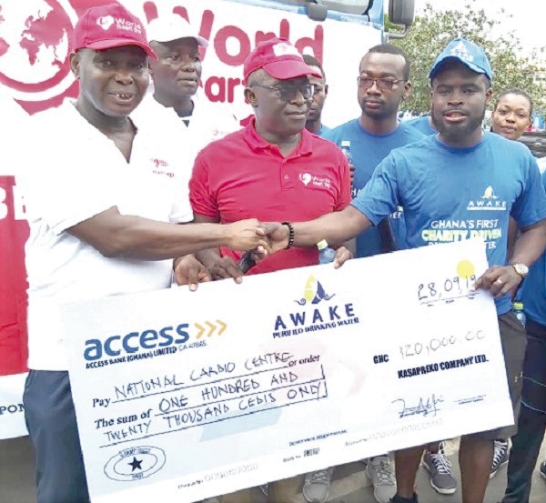  Mr Chris Addo-Sarkodie (right) presenting a dummy cheque for GH¢120,000 to Dr Lawrence Sereboe (left)