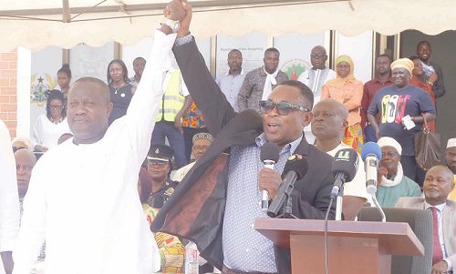 Mr Kofi Frimpong (right), Municipal Electoral Officer, La, declaring Mr Solomon Kotey-Nikoi as the Municipal Chief Executive elect for the La Dadekotopon Municipal Assembly. Picture: NII MARTEY M. BOTCHWAY