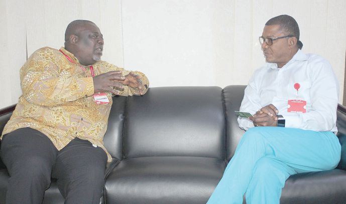  Mr Koku Anyidoho (left), Founder and CEO of the Atta Mills Institute, interacting with Mr Kobby Asmah (right), Editor of the Daily Graphic during a courtesy call at the head office in Accra. Picture: GABRIEL AHIABOR