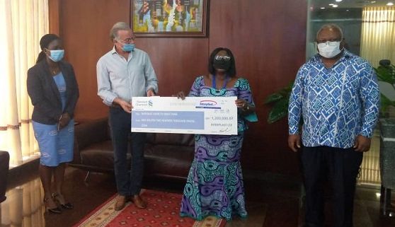  Mr Hayssam Fakhry,the Managing Director of Interplast Limited, presenting the cheque for GH¢1.2m to Mrs Akosua Frema Osei-Opare, the Chief of Staff. 